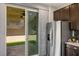 Kitchen featuring stainless steel appliances and sliding door to patio at 3484 Bradano Ln, Henderson, NV 89044