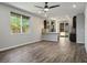 Open concept living area featuring hardwood floors and a modern kitchen at 3484 Bradano Ln, Henderson, NV 89044