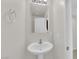 A sink and mirror in a well-lit bathroom with neutral wall paint at 367 Wilford Springs St, Henderson, NV 89014
