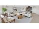 Bright, modern living room featuring a comfortable sectional sofa, stylish decor, and an open-concept design at 367 Wilford Springs St, Henderson, NV 89014