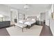 Beautiful staged main bedroom with a king bed, elegant decor, and ample closet space at 367 Wilford Springs St, Henderson, NV 89014