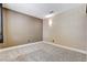 Basic bedroom featuring neutral walls, carpet flooring, and simple light fixtures at 3717 Shanagolden St, Las Vegas, NV 89129