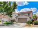 Two-story home with a two-car garage, low-maintenance yard, and nearby guest parking at 3717 Shanagolden St, Las Vegas, NV 89129