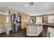 Open-concept kitchen boasts a large island, light cabinets, and stainless appliances, flowing into the living spaces at 3717 Shanagolden St, Las Vegas, NV 89129