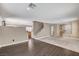 Spacious living room featuring carpet, wood flooring, staircase, and an open layout at 3717 Shanagolden St, Las Vegas, NV 89129