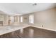 Living room with hardwood and carpet flooring, staircase and large windows provides natural light at 3717 Shanagolden St, Las Vegas, NV 89129