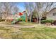 Community playground surrounded by green space and trees, featuring play equipment and picnic tables at 3717 Shanagolden St, Las Vegas, NV 89129