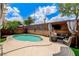 Wonderful backyard featuring a pool, decorative brick fencing, comfortable seating, and a relaxing ambiance at 3717 Shanagolden St, Las Vegas, NV 89129