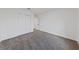 Bedroom with sliding closet, door to another room, and soft gray carpet throughout at 383 Virginia Lake Ave, Henderson, NV 89015