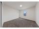 Clean, empty bedroom featuring plush carpet, neutral paint, and a bright window at 383 Virginia Lake Ave, Henderson, NV 89015