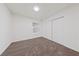 A vacant bedroom has neutral carpet, a window, and sliding closet doors for storage at 383 Virginia Lake Ave, Henderson, NV 89015