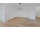 Empty dining room shows wood-look flooring and modern lighting at 383 Virginia Lake Ave, Henderson, NV 89015
