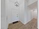 Bright foyer features wood-look flooring and a stylish hanging light fixture at 383 Virginia Lake Ave, Henderson, NV 89015