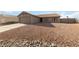 Single-story home with xeriscaped yard, two-car garage and neutral color palette at 383 Virginia Lake Ave, Henderson, NV 89015