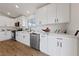 Bright kitchen featuring white cabinets, stainless steel appliances, and a modern design at 383 Virginia Lake Ave, Henderson, NV 89015