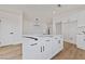 Kitchen island boasts quartz countertops, modern lighting, and ample cabinet space at 383 Virginia Lake Ave, Henderson, NV 89015