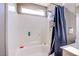 Bathroom featuring tiled shower with a built-in seat and shower products at 4429 E Azure Ave, Las Vegas, NV 89115