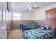 Bright bedroom featuring twin beds with colorful bedding and natural light at 4429 E Azure Ave, Las Vegas, NV 89115