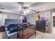 Bedroom featuring crib, bed, dresser, decorations, and a ceiling fan at 4429 E Azure Ave, Las Vegas, NV 89115