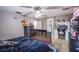Bedroom featuring crib, bed, dresser, decorations, and a ceiling fan at 4429 E Azure Ave, Las Vegas, NV 89115