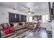 Comfortable living room showcasing a large sectional sofa, decorative lighting, and modern floors at 4429 E Azure Ave, Las Vegas, NV 89115