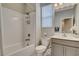 Well-lit bathroom features a shower over tub and vanity with ample storage space at 4537 Cloudrest Peak St, North Las Vegas, NV 89031