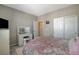 Comfortable bedroom featuring a vanity with drawers, white trim, and closet at 4537 Cloudrest Peak St, North Las Vegas, NV 89031