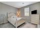 Bedroom with carpet flooring, one window, tv, and a pink rug at 4537 Cloudrest Peak St, North Las Vegas, NV 89031