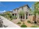 Attractive home exterior with desert landscaping, a paved walkway, and a stone accent wall at 4537 Cloudrest Peak St, North Las Vegas, NV 89031