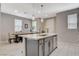 Kitchen island area with sink, dishwasher and barstool seating at 4537 Cloudrest Peak St, North Las Vegas, NV 89031