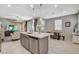 Open-concept kitchen overlooking a living area and dining table at 4537 Cloudrest Peak St, North Las Vegas, NV 89031