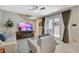 Comfortable living room with a fireplace, patio doors, and neutral décor, creating a relaxing atmosphere at 4537 Cloudrest Peak St, North Las Vegas, NV 89031