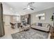 Open concept living area showcasing a kitchen island, living room, and coordinated decor at 4537 Cloudrest Peak St, North Las Vegas, NV 89031
