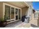 Enclosed patio with sliding doors, a grill, and low-maintenance gravel and tile pavers at 4537 Cloudrest Peak St, North Las Vegas, NV 89031