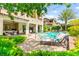 View of backyard pool area with a spa, glass fencing, patio, lawn, and landscaping, perfect for outdoor enjoyment at 454 Rosina Vista St, Las Vegas, NV 89138