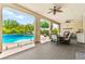Covered patio leading to a swimming pool with manicured landscaping at 454 Rosina Vista St, Las Vegas, NV 89138