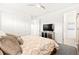 This bedroom has a bed, a ceiling fan, and a TV on a mirrored dresser at 454 Rosina Vista St, Las Vegas, NV 89138