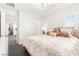 Bright bedroom features a window with shutters, neutral color scheme, and an attached closet at 454 Rosina Vista St, Las Vegas, NV 89138
