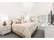 This bedroom has a large bed, decorative light fixture, and a shelf at 454 Rosina Vista St, Las Vegas, NV 89138