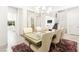 Elegant dining room featuring neutral decor and an open concept layout into the stairs and living area at 454 Rosina Vista St, Las Vegas, NV 89138