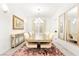 The formal dining room features modern lighting, elegant decor, and ample seating for sophisticated dinner parties at 454 Rosina Vista St, Las Vegas, NV 89138