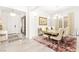 Elegant dining room with a large table, chandelier, and plush rug, perfect for gatherings at 454 Rosina Vista St, Las Vegas, NV 89138