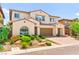 Well-maintained two-story home with lush, manicured landscaping and terracotta tile roof at 454 Rosina Vista St, Las Vegas, NV 89138