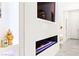 Modern linear fireplace with a sleek white surround and decorative display shelves at 454 Rosina Vista St, Las Vegas, NV 89138