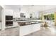 Bright eat-in kitchen with white cabinets, dark countertops, and stainless steel appliances at 454 Rosina Vista St, Las Vegas, NV 89138