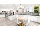 Open-concept kitchen and breakfast nook showcases granite counters, stainless appliances, and ample seating for casual dining at 454 Rosina Vista St, Las Vegas, NV 89138