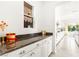 Granite countertops in the kitchen offer ample space, complemented by white cabinetry and views of the breakfast nook at 454 Rosina Vista St, Las Vegas, NV 89138