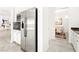 Bright and spacious kitchen features stainless steel appliances and sleek countertops with seamless flow into dining area at 454 Rosina Vista St, Las Vegas, NV 89138