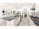 Bright kitchen boasts stainless steel appliances, granite countertops, and a seamless open-concept design for modern living at 454 Rosina Vista St, Las Vegas, NV 89138