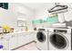 Bright laundry room equipped with modern appliances and ample counter space for convenience at 454 Rosina Vista St, Las Vegas, NV 89138